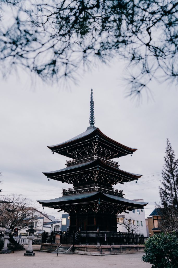 the 3 tiered black tower of kokobunji temple in takayama