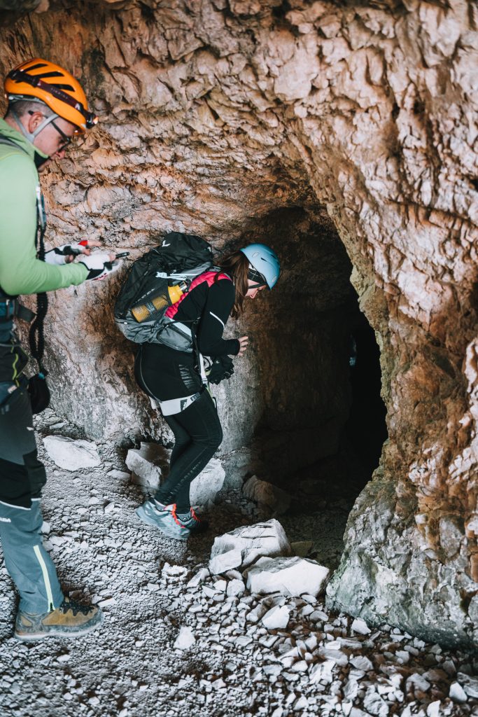 Hikers entering the via ferrata in the world war 2 tunnels above the Tre Cime di Lavaredo