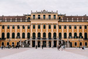 The grand yellow columned building of the Schönbrunn Palace is one of the best things to do in Vienna on a 2 week Central Europe itinerary