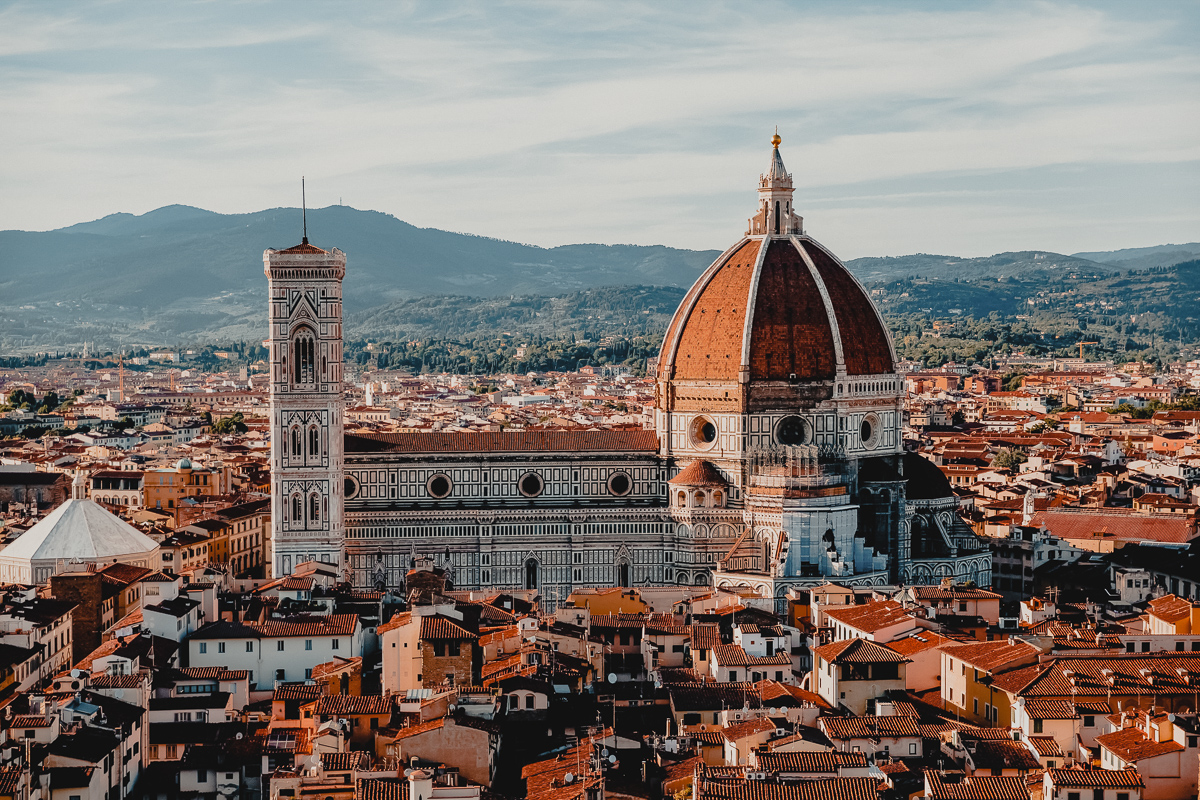 The terracotta rooftops of Florence and the famous Duomo cover of Italy Travel Guide